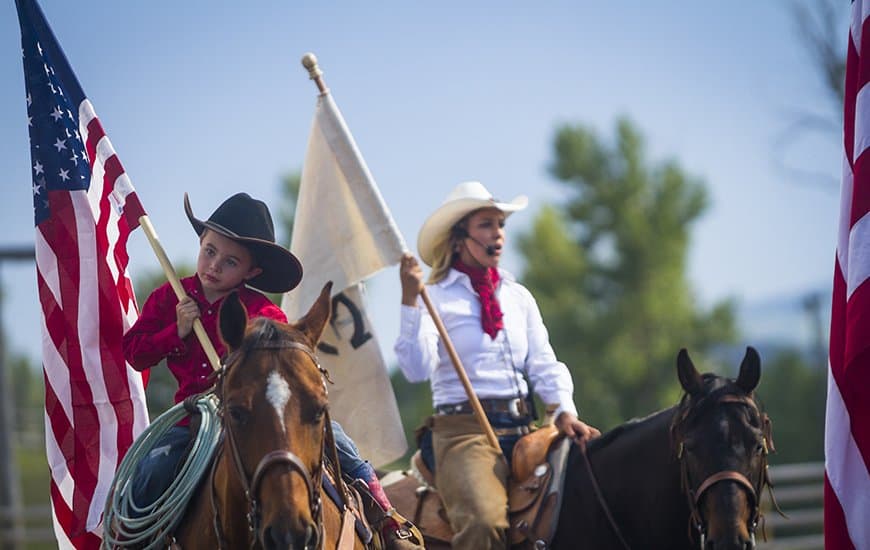 A flag ceremony during a Fourth of July ranch rodeo